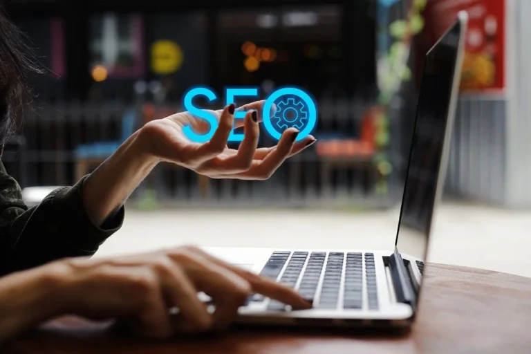SEO specialist working on his website with a laptop